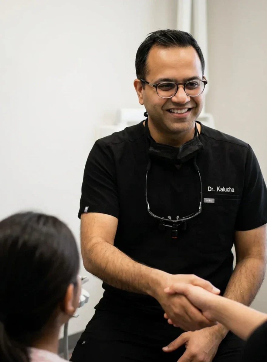 Dr. Aman Kalucha greeting a patient at Mount Lehman Dental
